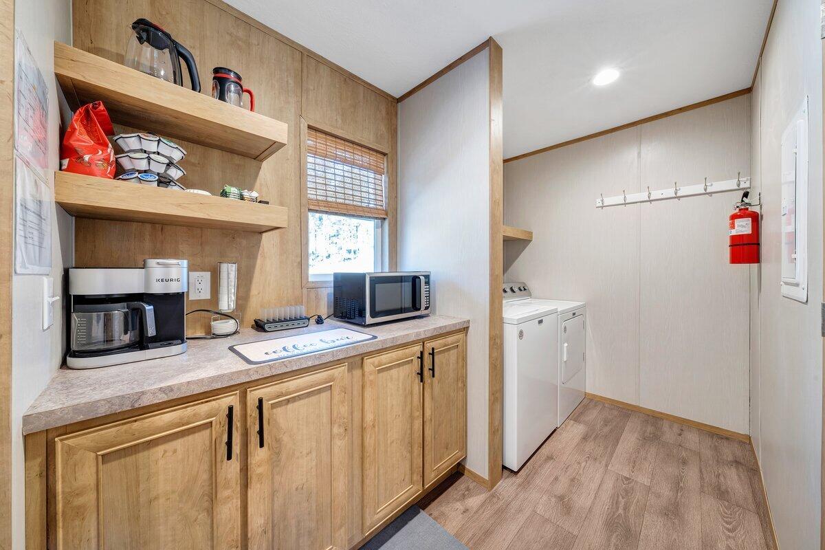 780 Adkins Road Penhook, VA 24137 - Photo 33 of 49 a kitchen with a sink and a refrigerator