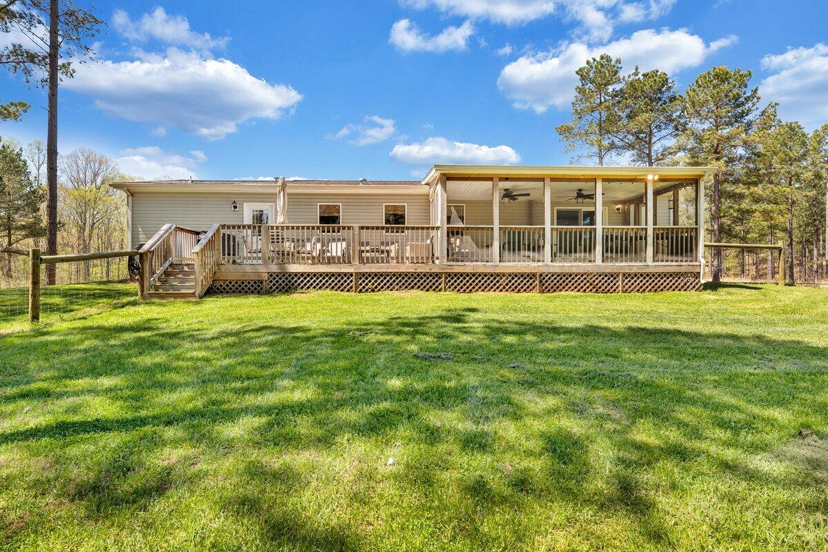 780 Adkins Road Penhook, VA 24137 - Photo 4 of 49 a swimming pool with outdoor seating and yard