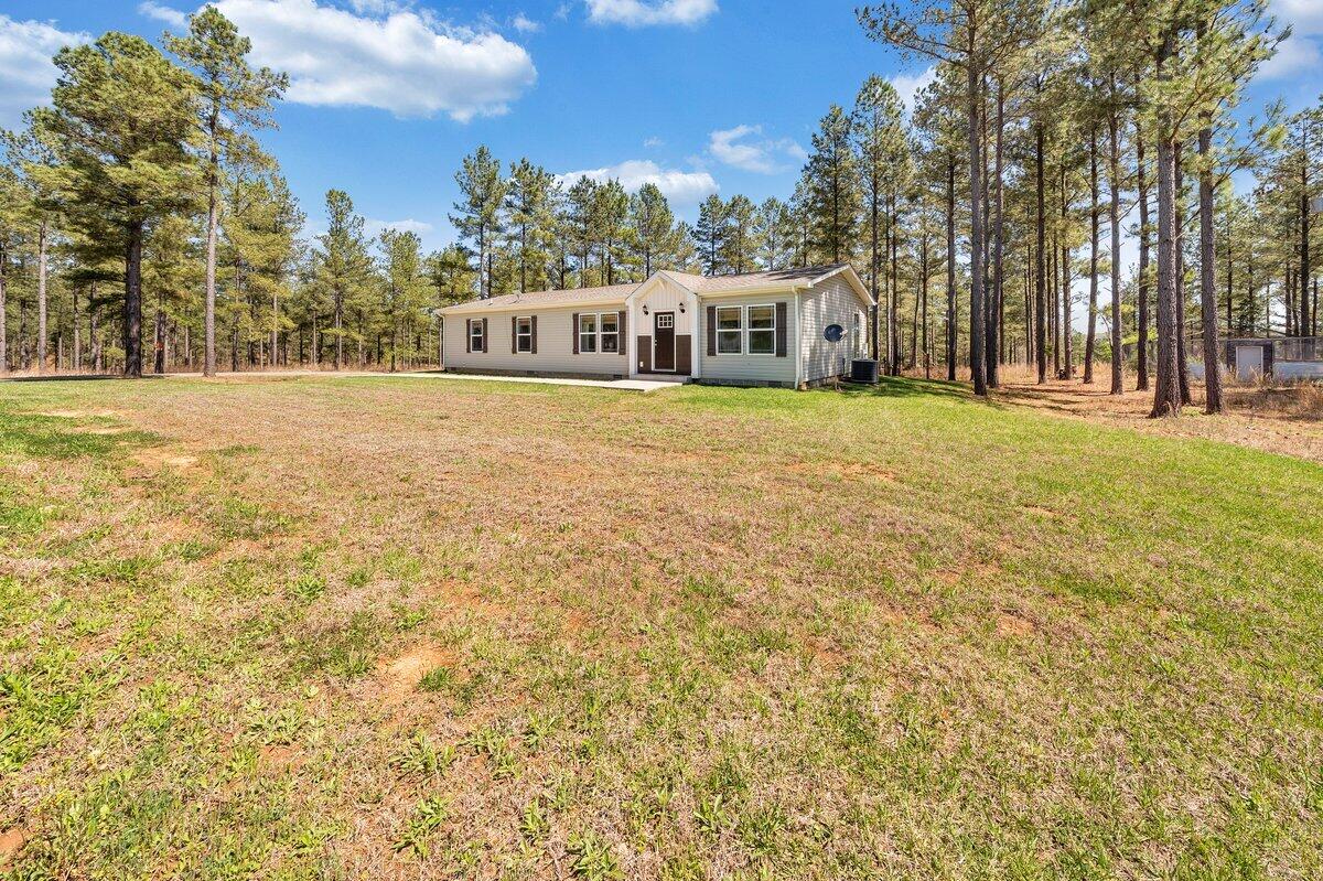 780 Adkins Road Penhook, VA 24137 - Photo 5 of 49 a front view of a house with a yard