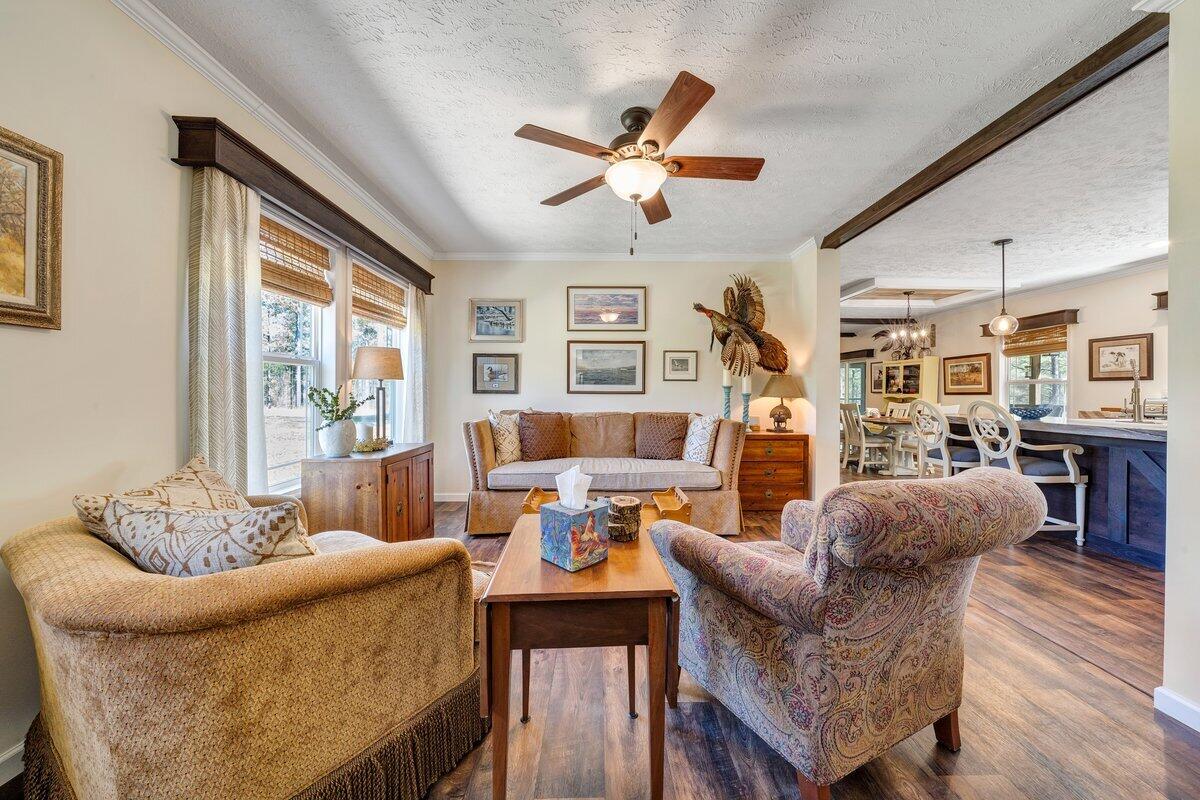 780 Adkins Road Penhook, VA 24137 - Photo 7 of 49 a living room with furniture and a large window