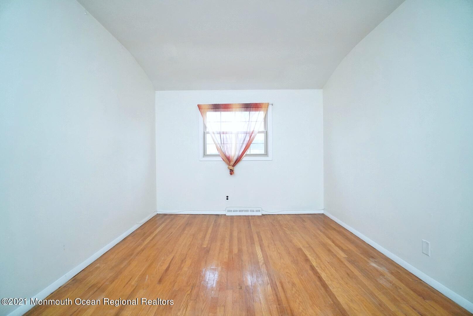 112 Acorn Lane Voorhees, NJ 08043 - Photo 24 of 42 a view of a room with wooden floor and a window