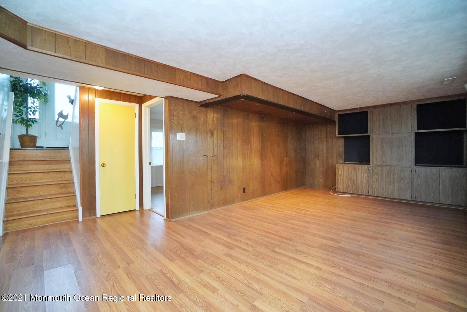 112 Acorn Lane Voorhees, NJ 08043 - Photo 29 of 42 a view of an empty room with wooden floor and a window