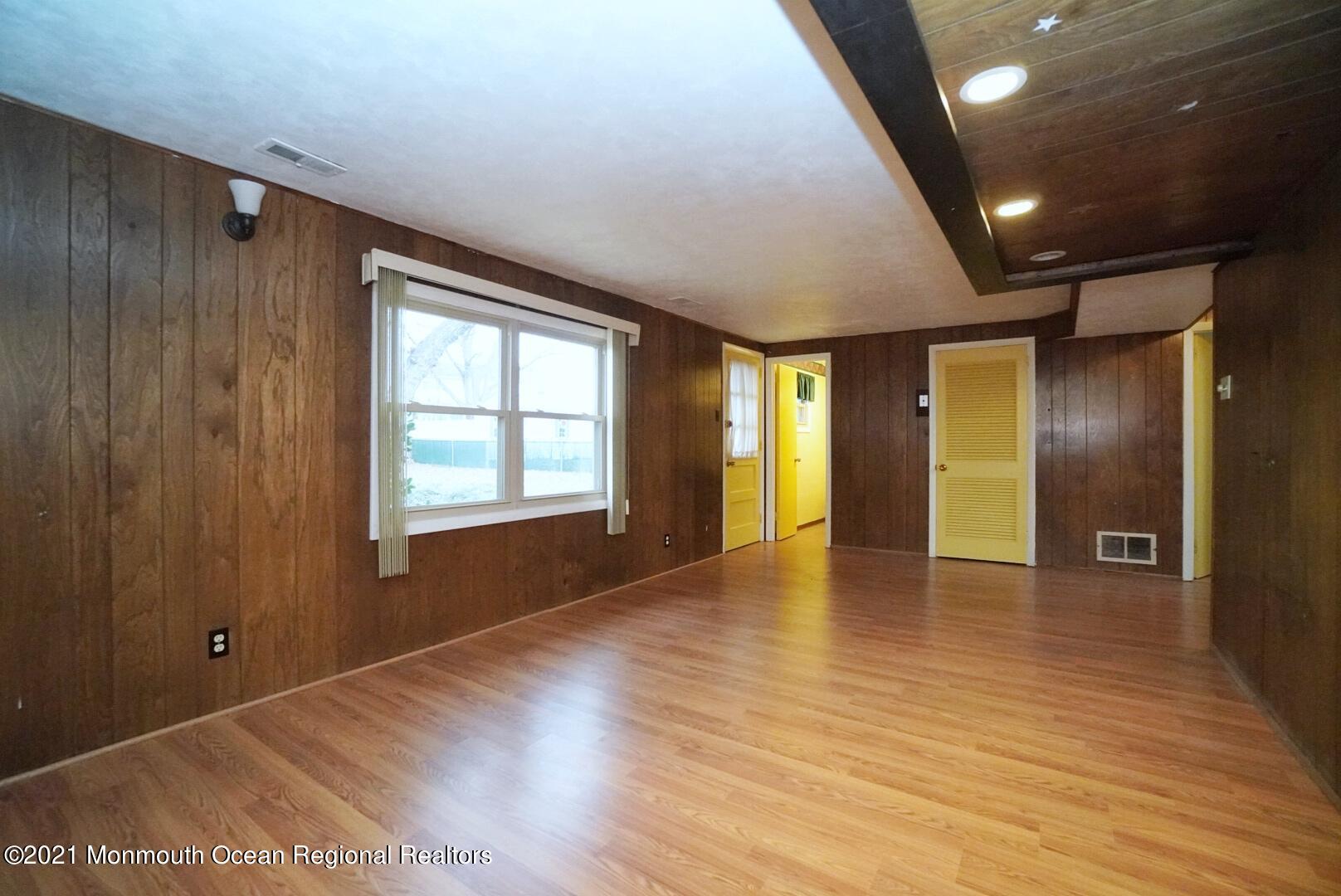 112 Acorn Lane Voorhees, NJ 08043 - Photo 31 of 42 a view of an empty room with window and wooden floor