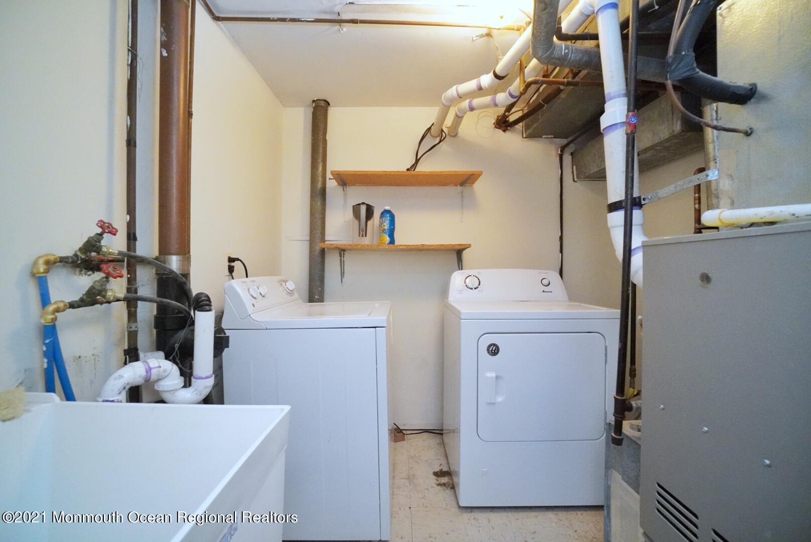 112 Acorn Lane Voorhees, NJ 08043 - Photo 37 of 42 a utility room with dryer and washer