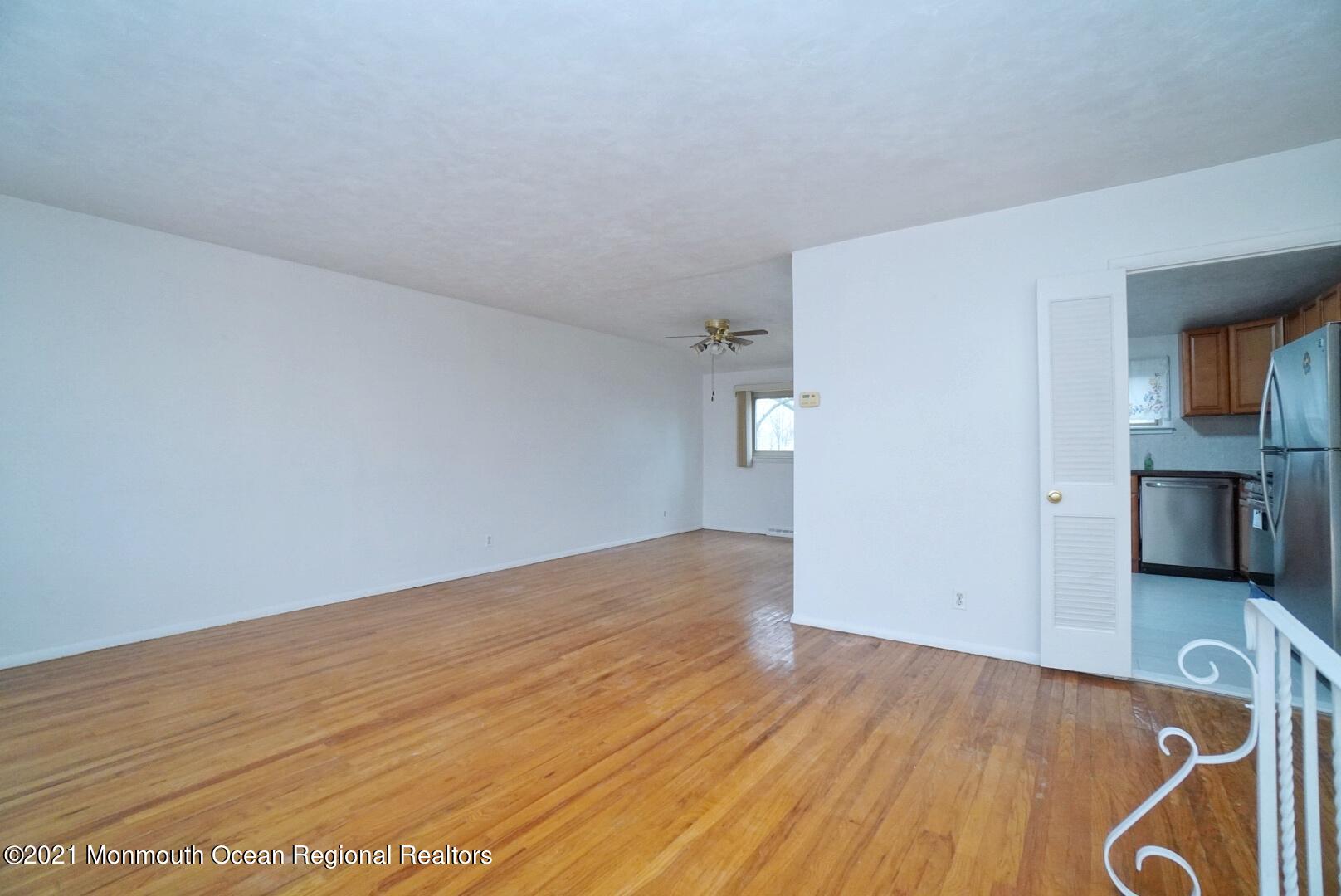 112 Acorn Lane Voorhees, NJ 08043 - Photo 8 of 42 a view of empty room with wooden floor