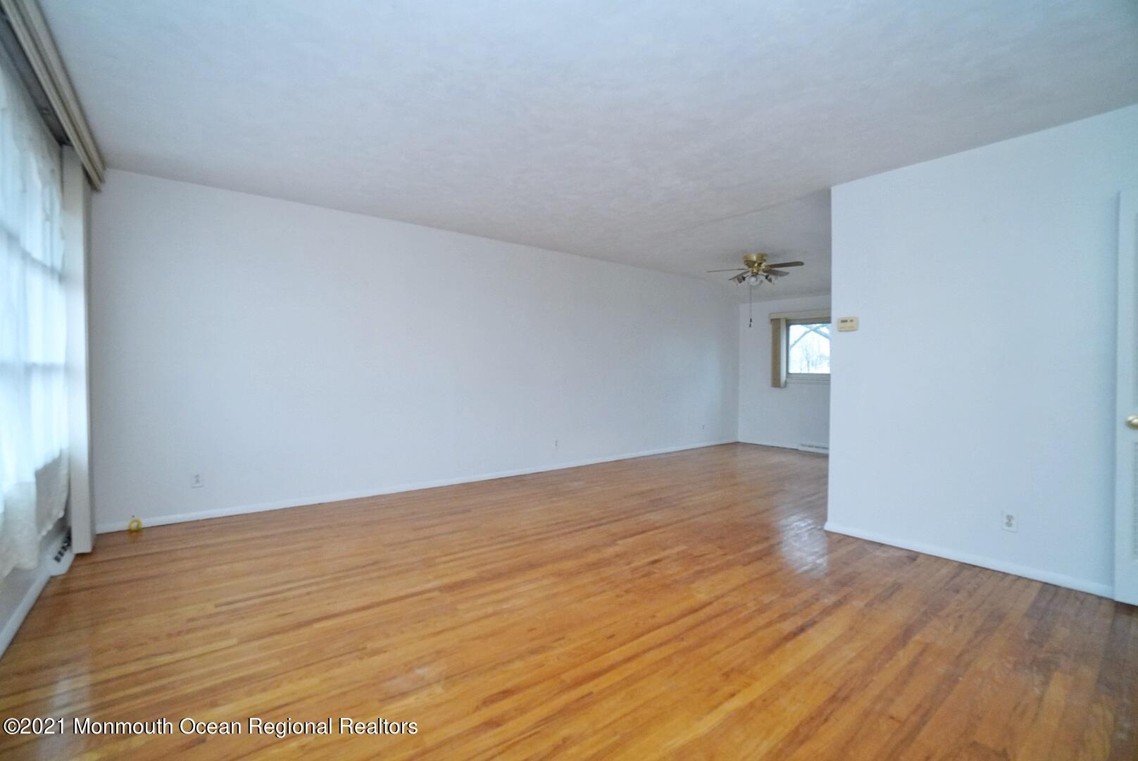 112 Acorn Lane Voorhees, NJ 08043 - Photo 9 of 42 a view of empty room with wooden floor