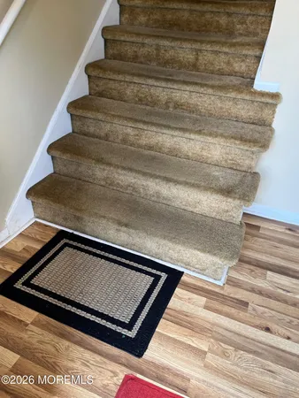 a kitchen with a refrigerator stove and cabinets