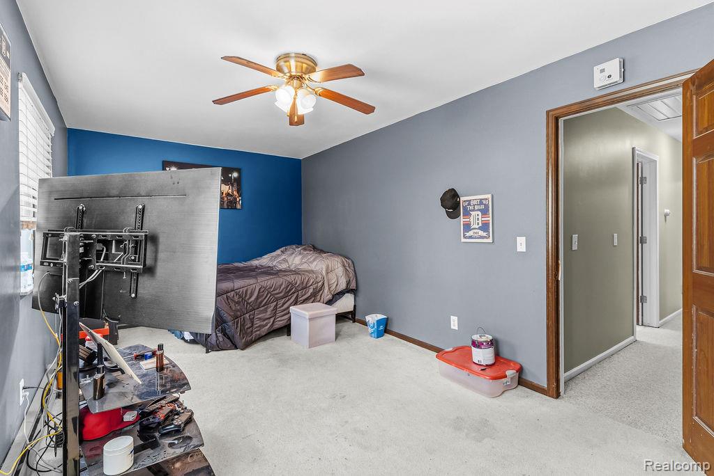 11111 Hibner Road Hartland, MI 48353 - Photo 39 of 59 Bedroom featuring light colored carpet and a ceiling fan
