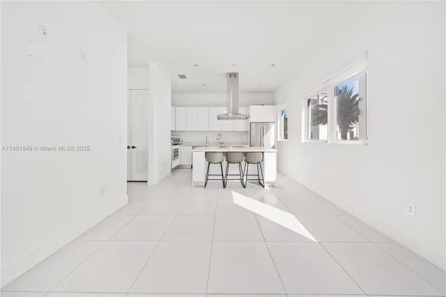 a view of kitchen with furniture and cabinets