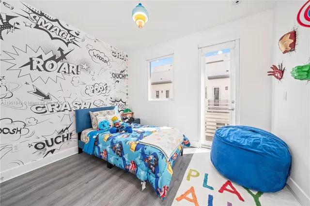 a bedroom with bed and window