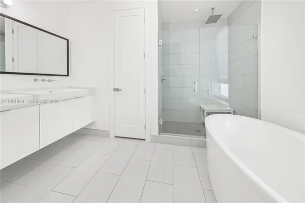 a bathroom with a sink a mirror and vanity
