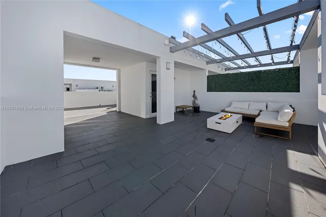 a kitchen with stainless steel appliances granite countertop a stove and a refrigerator