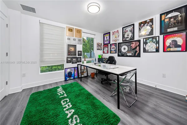 a living room with furniture and a bookshelf
