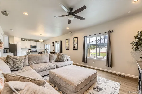 a living room with furniture and a window