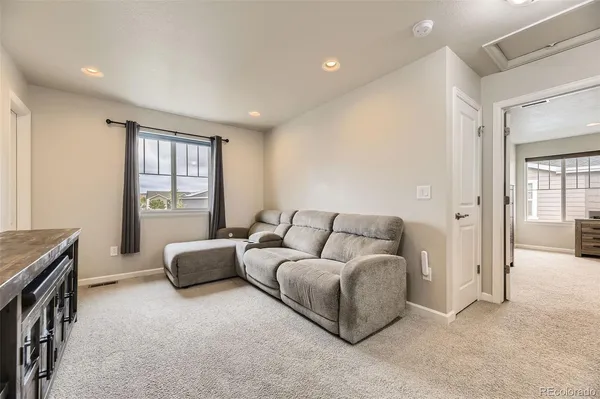 a living room with furniture and a window