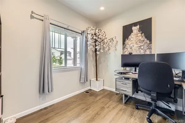 a workspace with furniture and a window