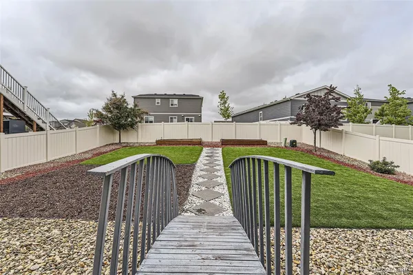 a view of a backyard with sitting area