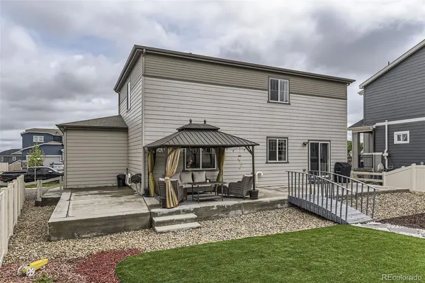 a front view of house with yard outdoor seating and barbeque oven