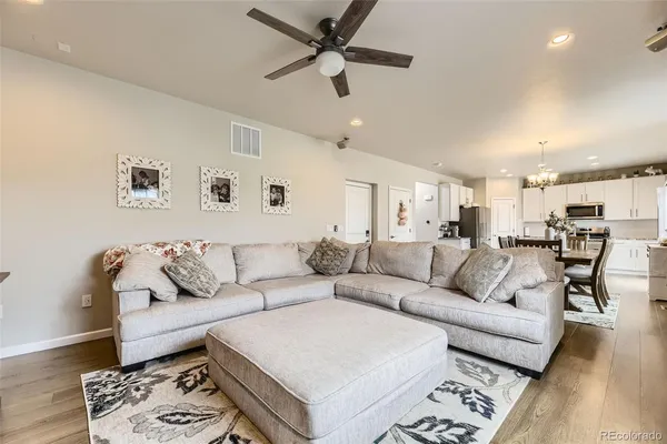 a living room with furniture and a rug