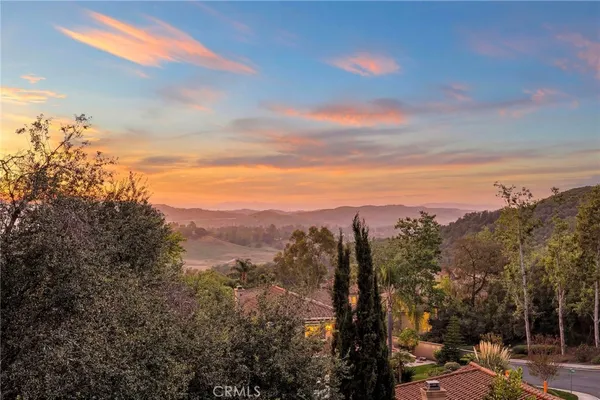 a view of a city with mountains in the background