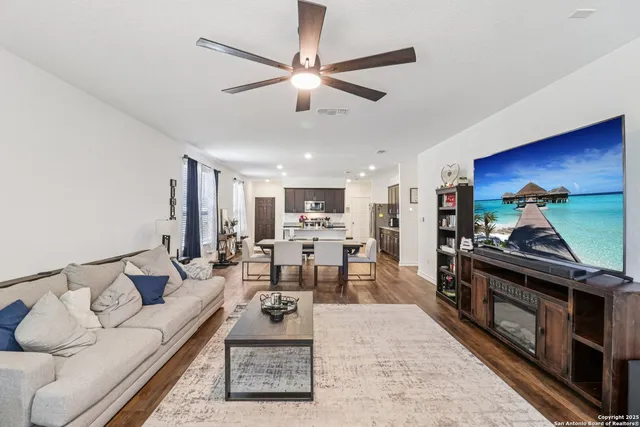 a living room with furniture and a fireplace