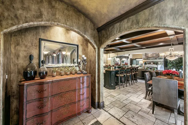 a kitchen with a refrigerator and a stove