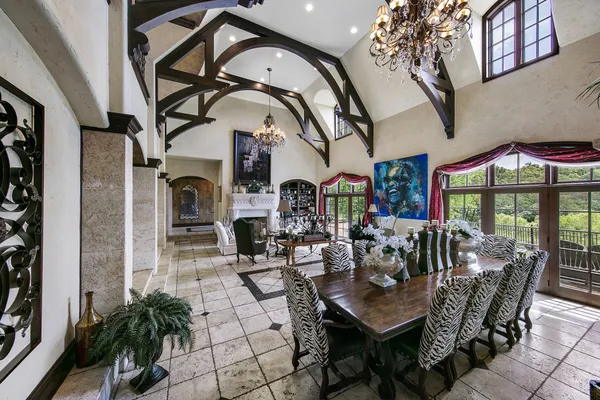 a room with fireplace and a chandelier