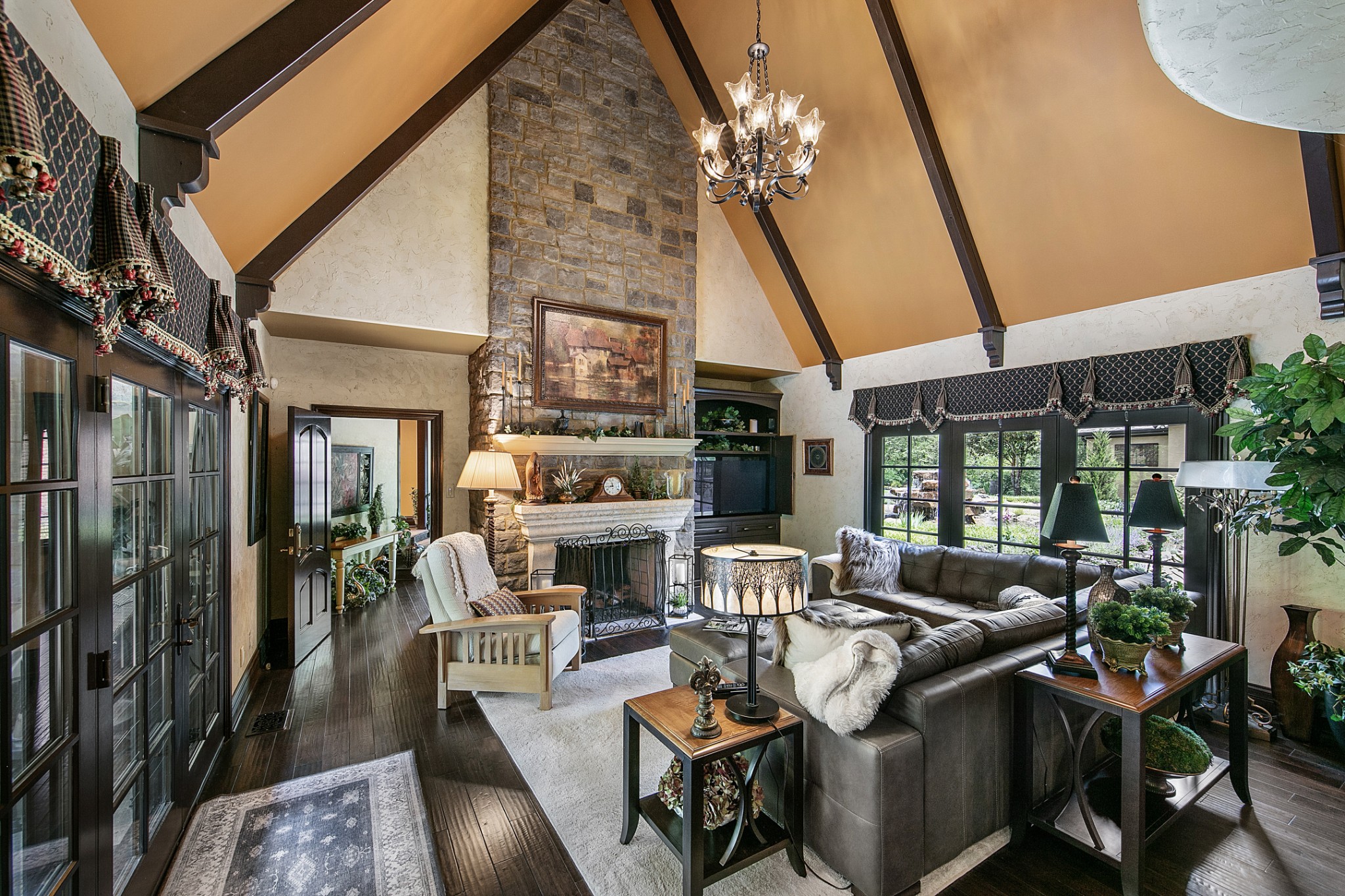 255 Villa Segrata North Ridge Road Sevierville, TN 37876 - Photo 33 of 78 a living room with furniture a fireplace and a dining table with wooden floor