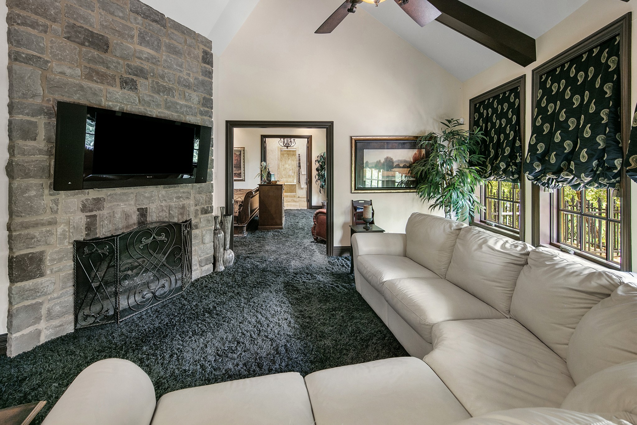 255 Villa Segrata North Ridge Road Sevierville, TN 37876 - Photo 40 of 78 a living room with furniture a flat screen tv and a fireplace