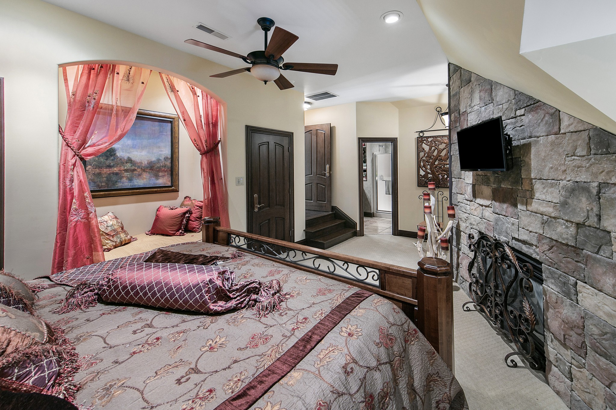 255 Villa Segrata North Ridge Road Sevierville, TN 37876 - Photo 51 of 78 a bedroom with a bed a flat screen tv and a fireplace