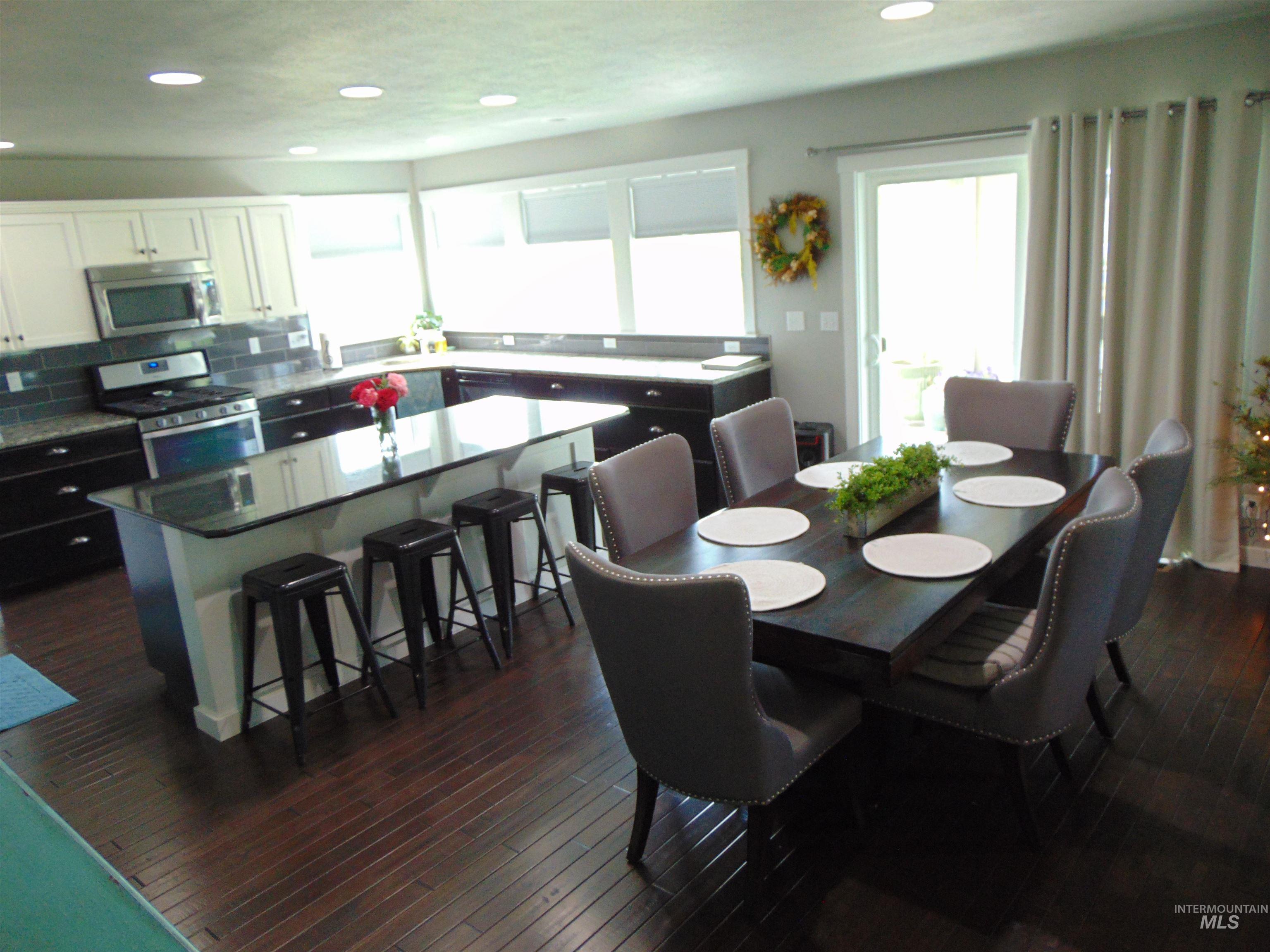 983 South Street Vale, OR 97918 - Photo 12 of 36 Dining room featuring dark wood-style floors and recessed lighting