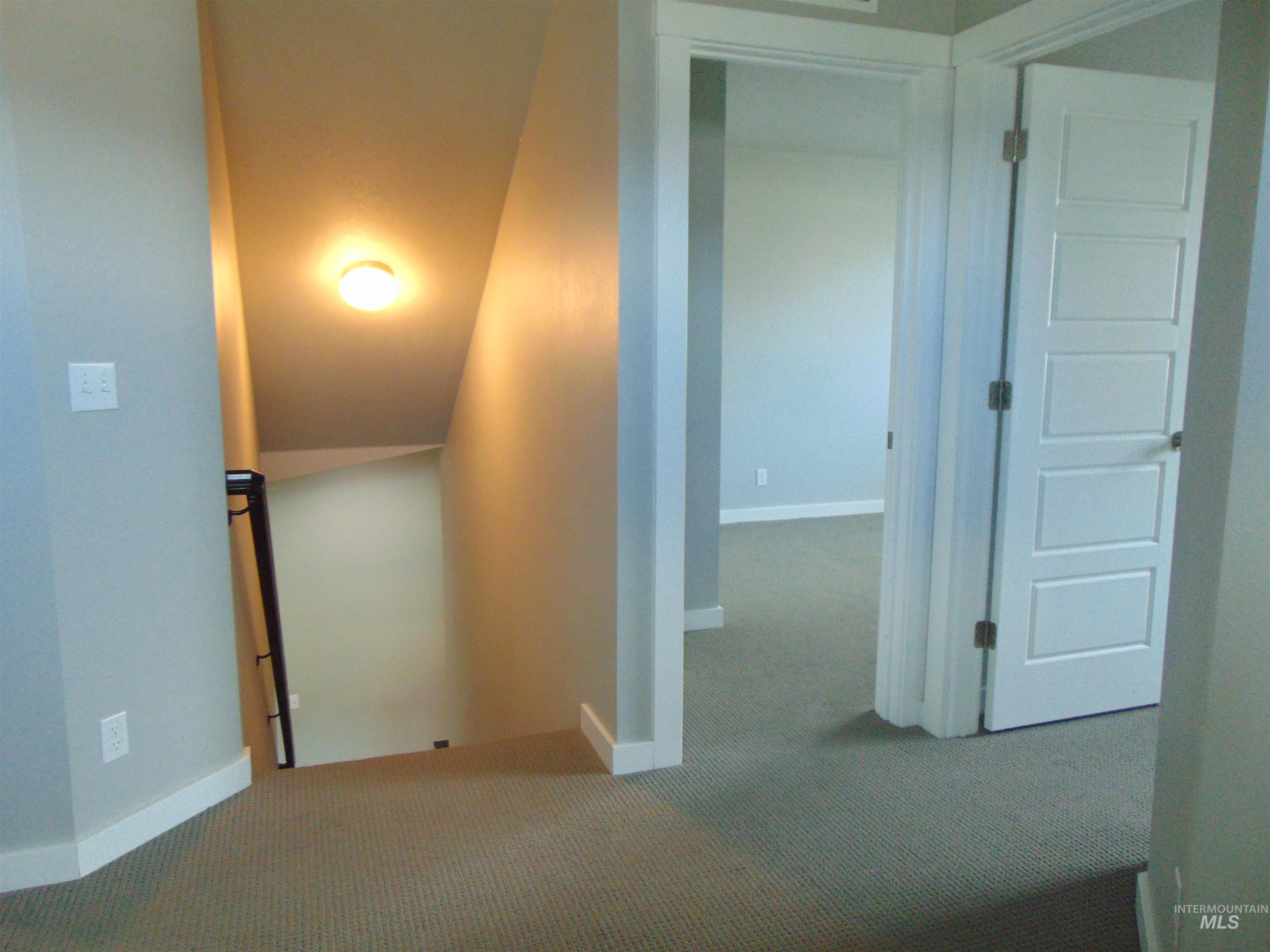 983 South Street Vale, OR 97918 - Photo 29 of 36 Corridor featuring carpet and baseboards