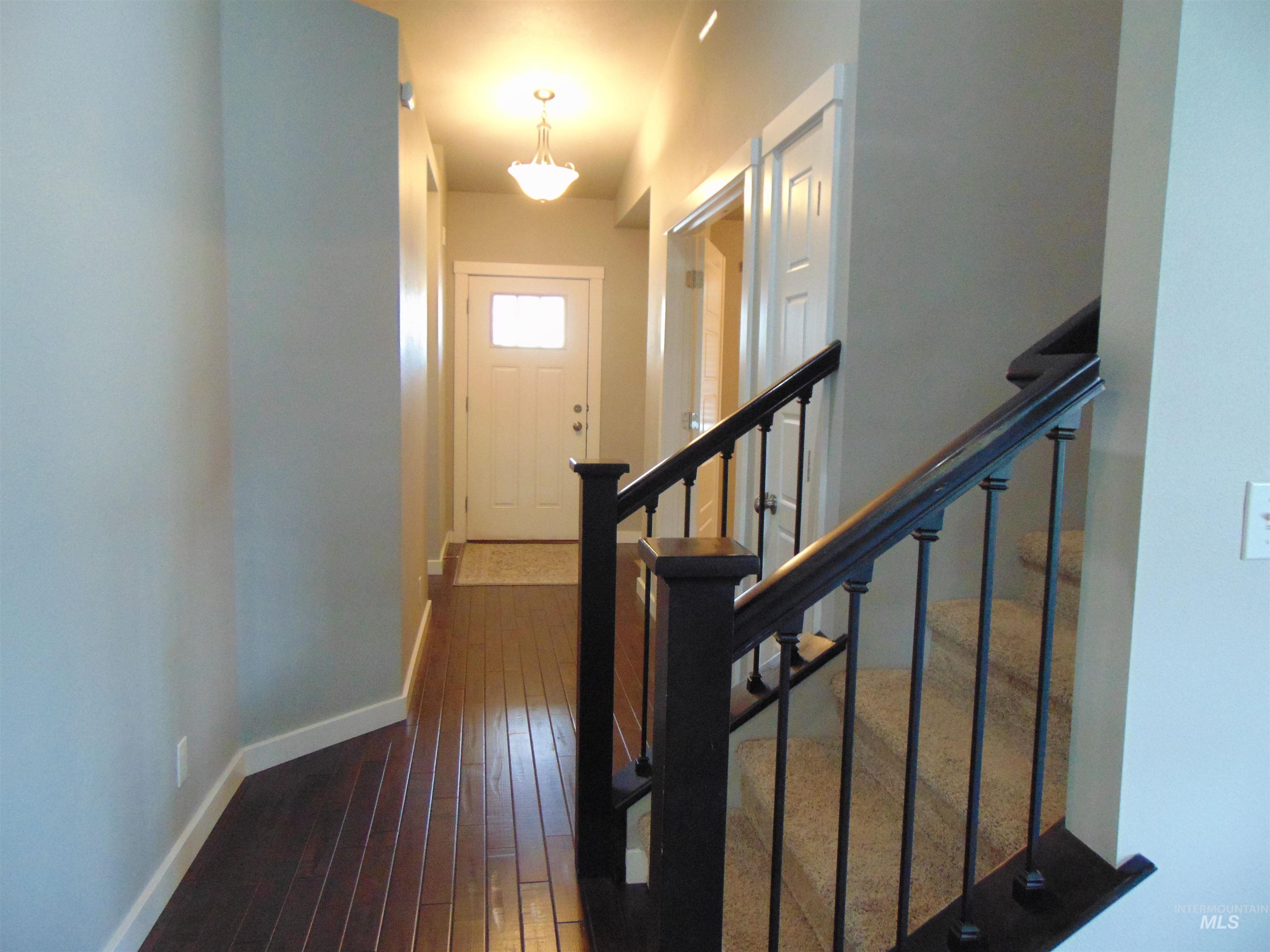 983 South Street Vale, OR 97918 - Photo 9 of 36 Stairway featuring hardwood / wood-style floors and baseboards