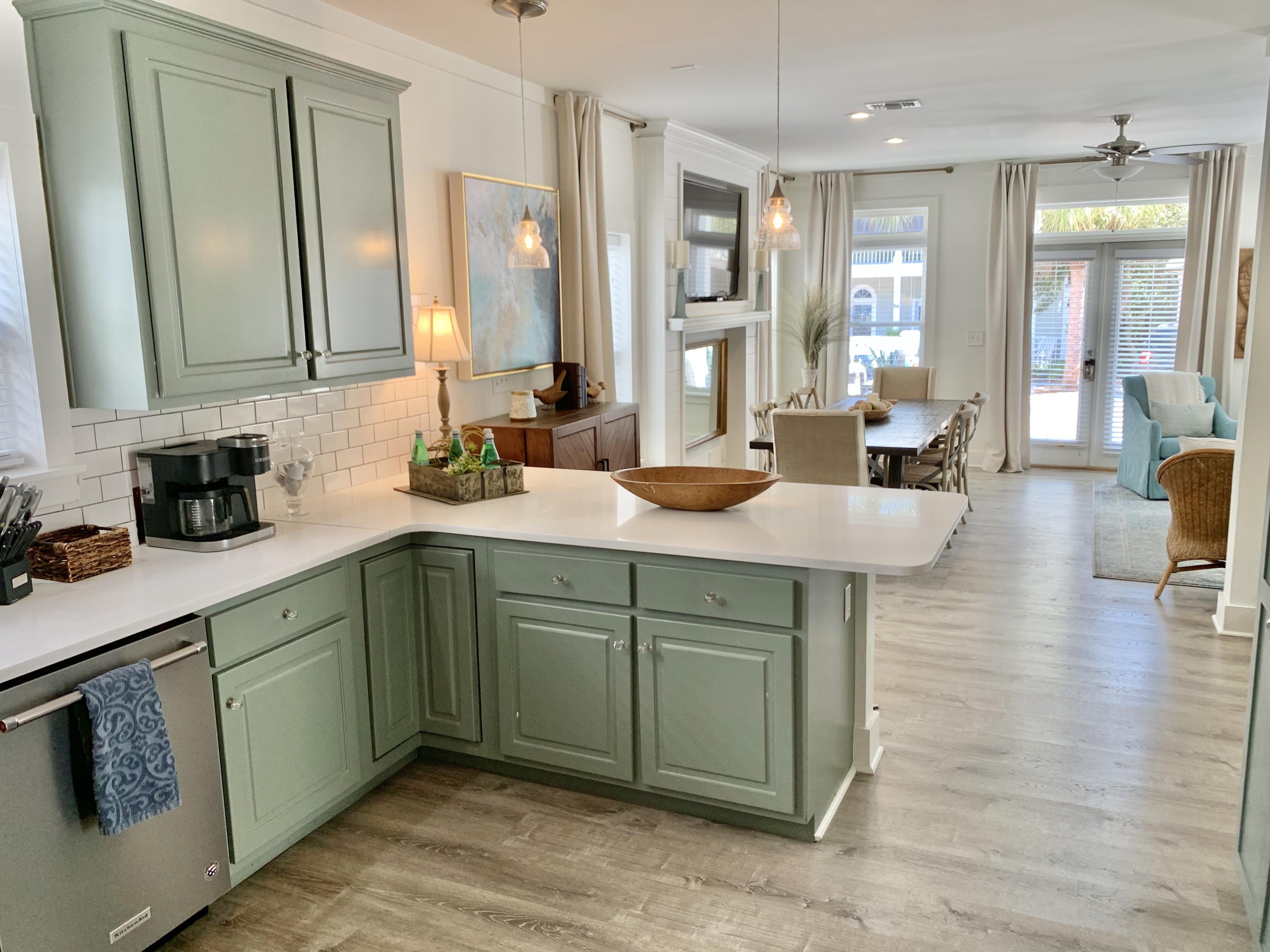 60 The Greenway Loop Inlet Beach, FL 32461 - Photo 21 of 35 a kitchen with a sink and cabinets