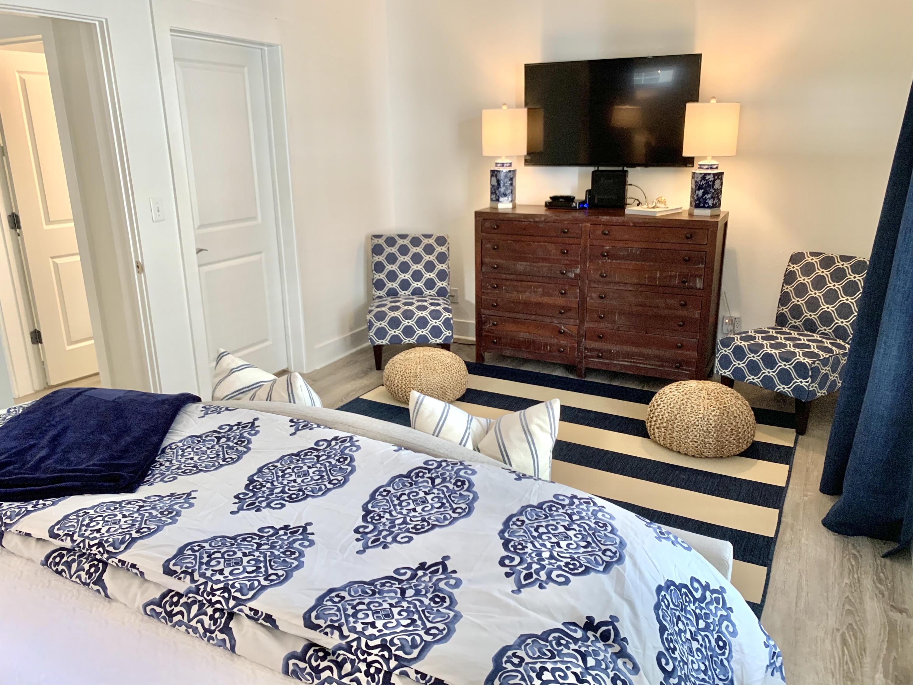 60 The Greenway Loop Inlet Beach, FL 32461 - Photo 25 of 35 a bedroom with a bed and flat screen tv