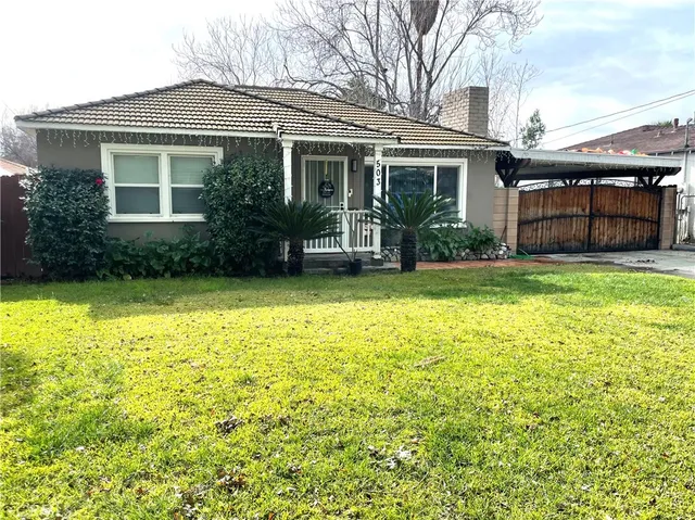 front view of a house with a yard