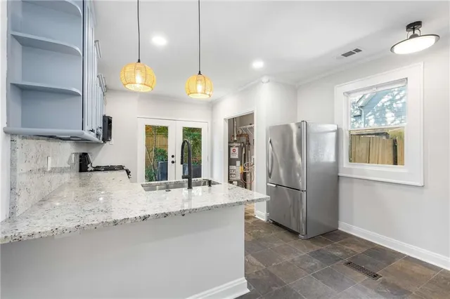 a view of a kitchen with a sink and window