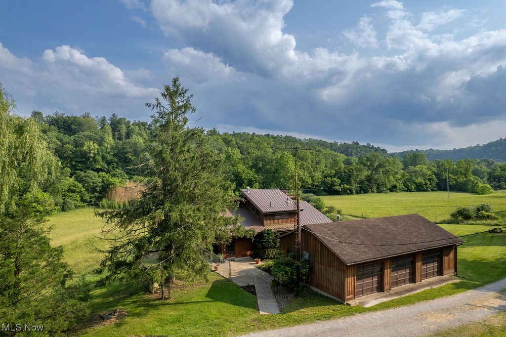 View from above of property with a heavily wooded area