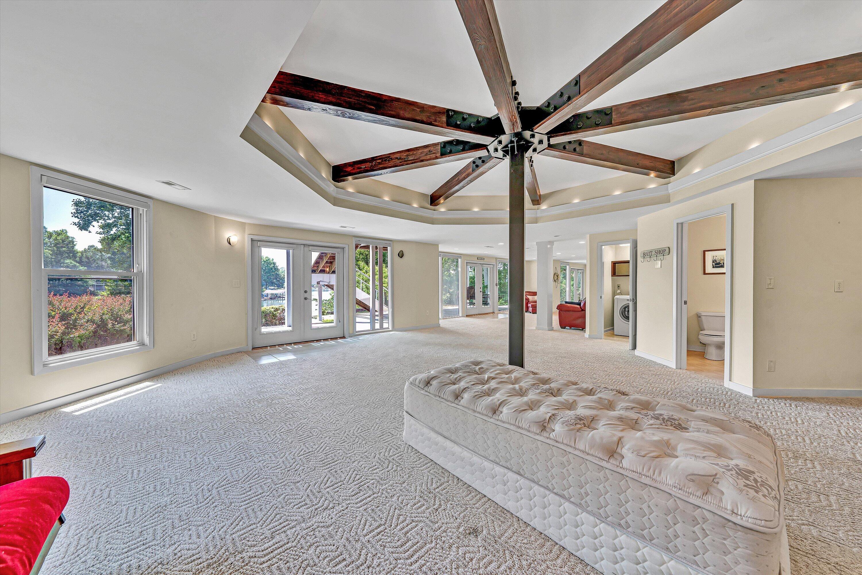 207 Winding Way Union Hall, VA 24176 - Photo 33 of 60 a spacious bedroom with a large bed and a large window