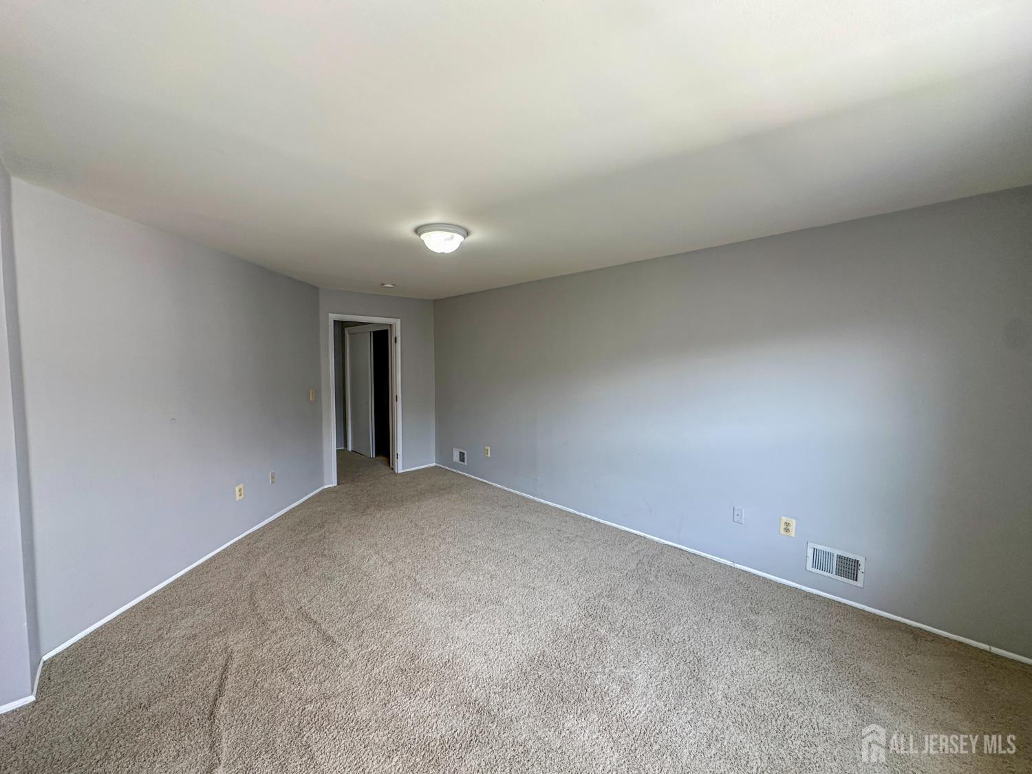 1212 Plymouth Road North Brunswick, NJ 08902 - Photo 23 of 27 a view of an empty room and window
