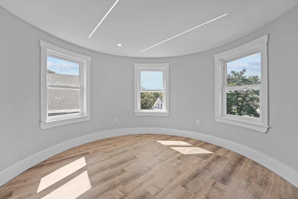 19-21 Standard Street, Unit 3 Boston, MA 02126 - Photo 14 of 23 a view of empty room with window