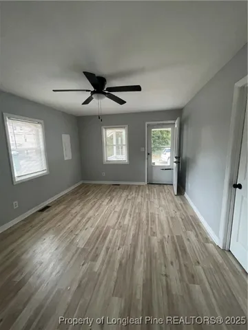 a kitchen with granite countertop a sink and cabinets