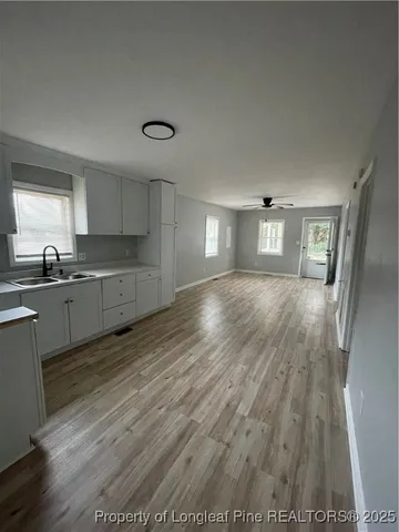 a kitchen with a sink and cabinets