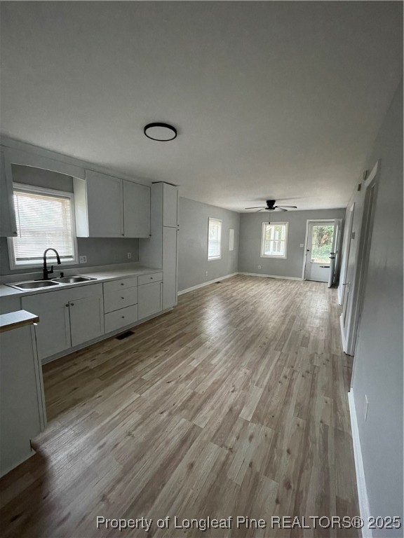 1106 Simpson Street Fayetteville, NC 28305 - Photo 6 of 14 a kitchen with granite countertop a sink and cabinets