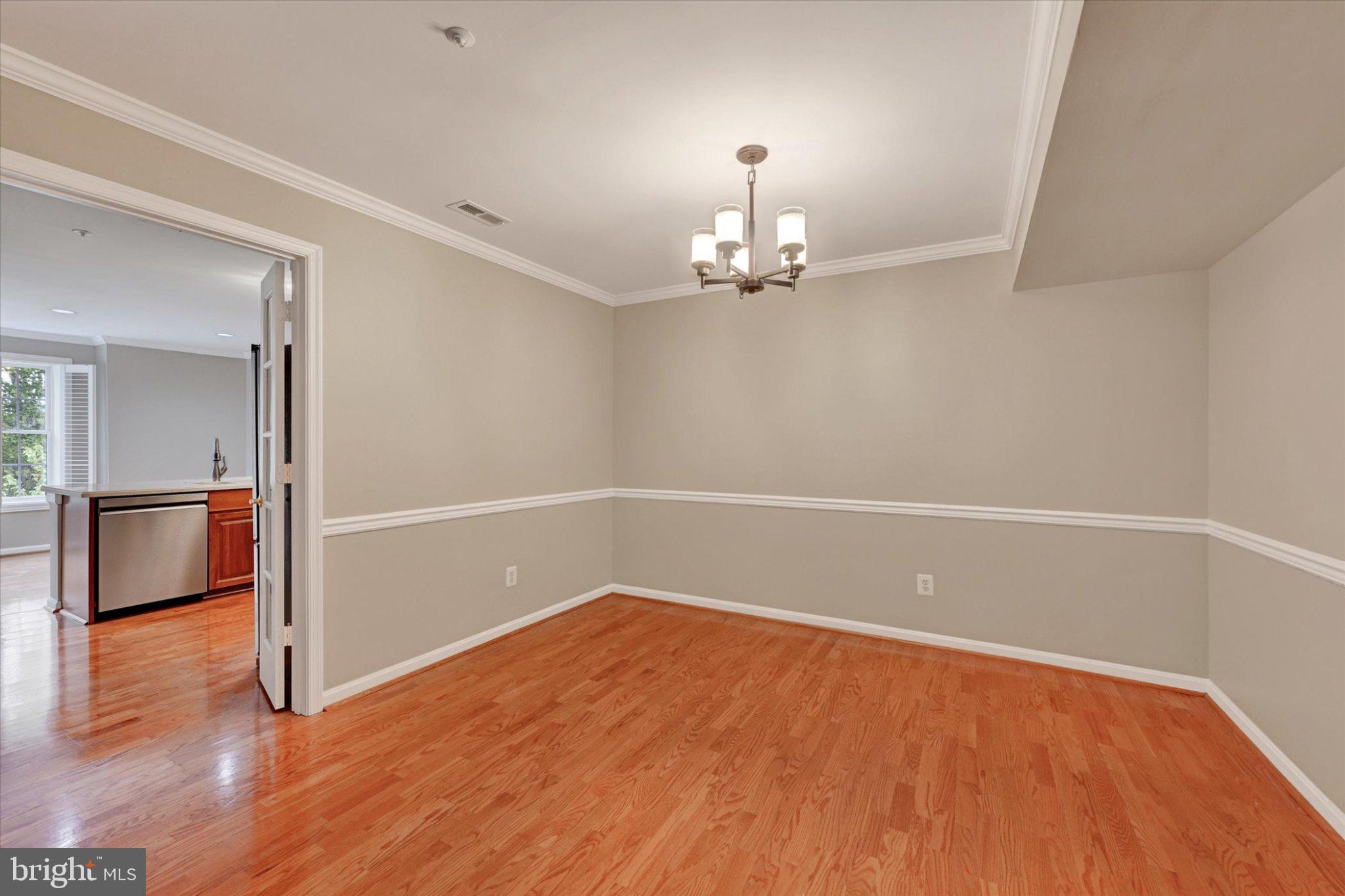 12310 Rosslare Ridge Road, Unit 405 Lutherville-Timonium, MD 21093 - Photo 9 of 30 Elegant space with warm wood floors.