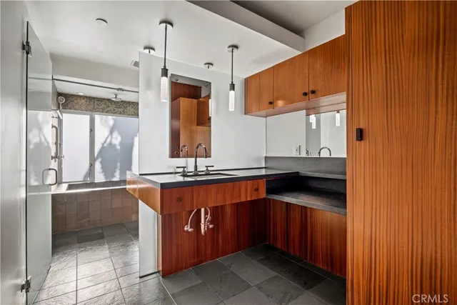 a kitchen with stainless steel appliances a sink and a refrigerator