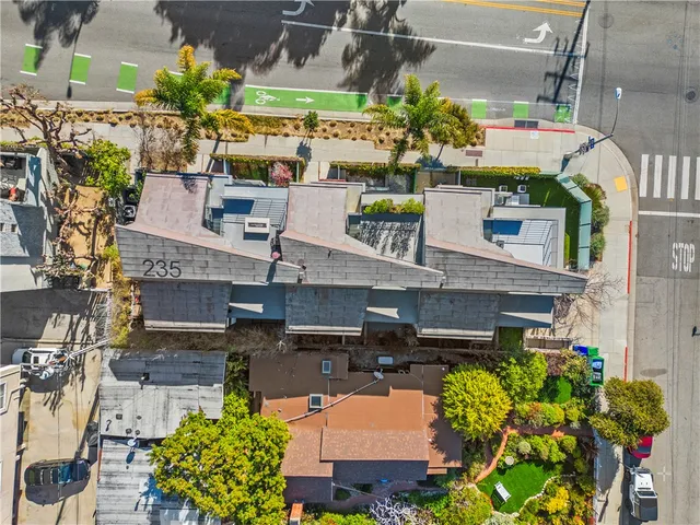 an aerial view of a houses with yard