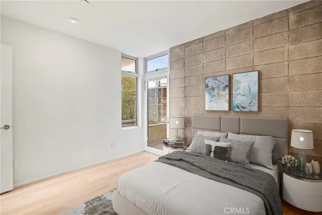 a living room with furniture a rug and a window