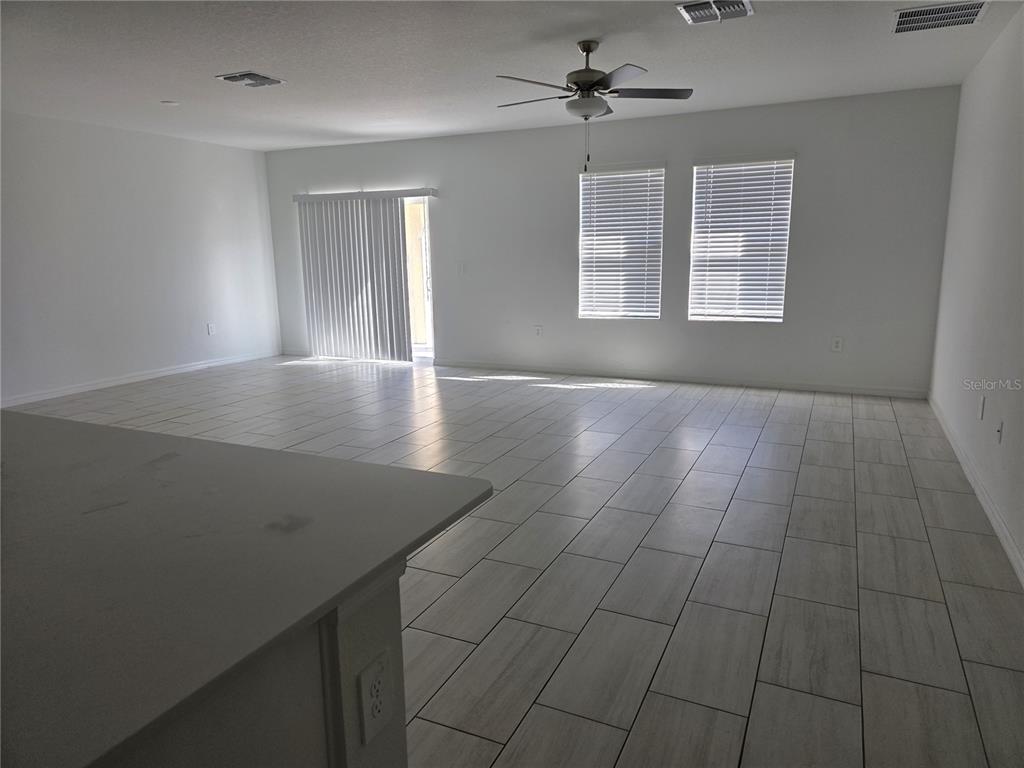 12588 Timber Moss Lane Riverview, FL 33579 - Photo 5 of 10 a view of livingroom with hardwood floor and ceiling fan