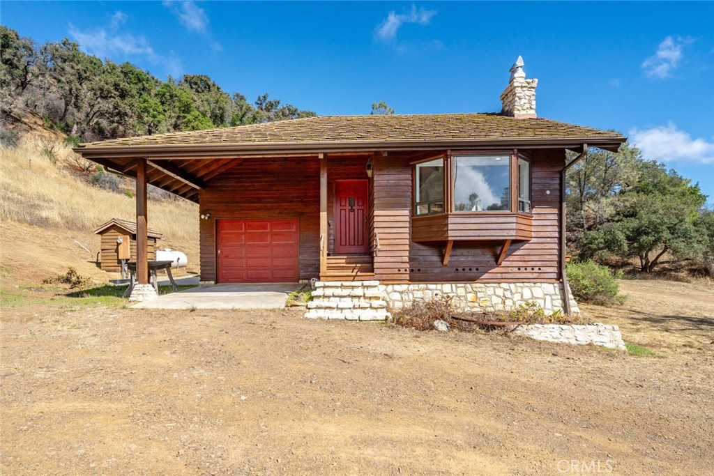 3265 Cypress Mountain Road Templeton, CA 93465 - Photo 27 of 32 a front view of a house with a yard
